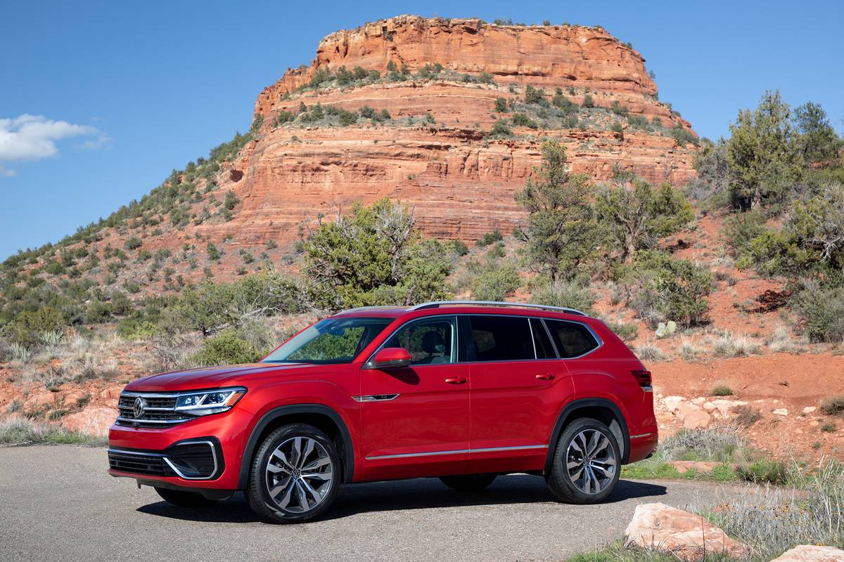A red 2021 Volkswagen Atlas SEL Premium 4Motion in front of a desert mountain