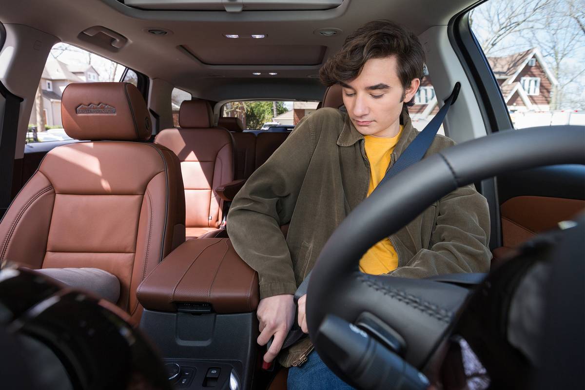 Premium Photo  Serious schoolgirl looking aside while sitting in car