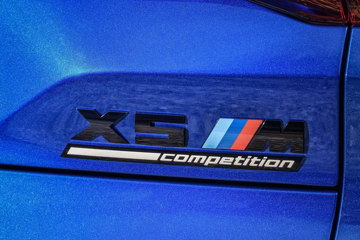 bmw x5m 2020 08 badge  blue  detail  exterior  rear jpg