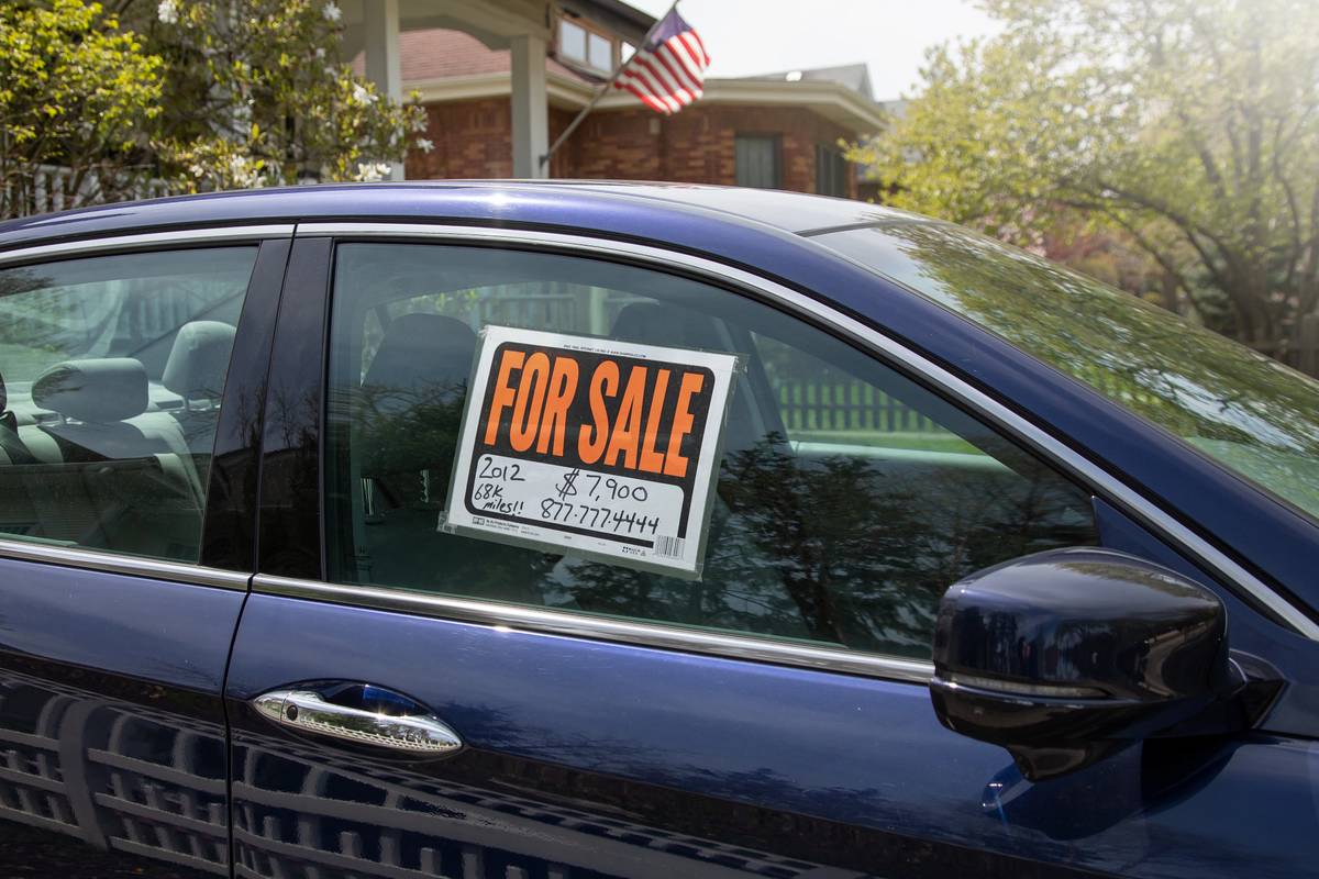For sale by owner sign on a car