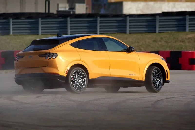 ford-mustang-mach-e-gt-2021-oem-03-angle--dynamic--exterior--rear--yellow.jpg