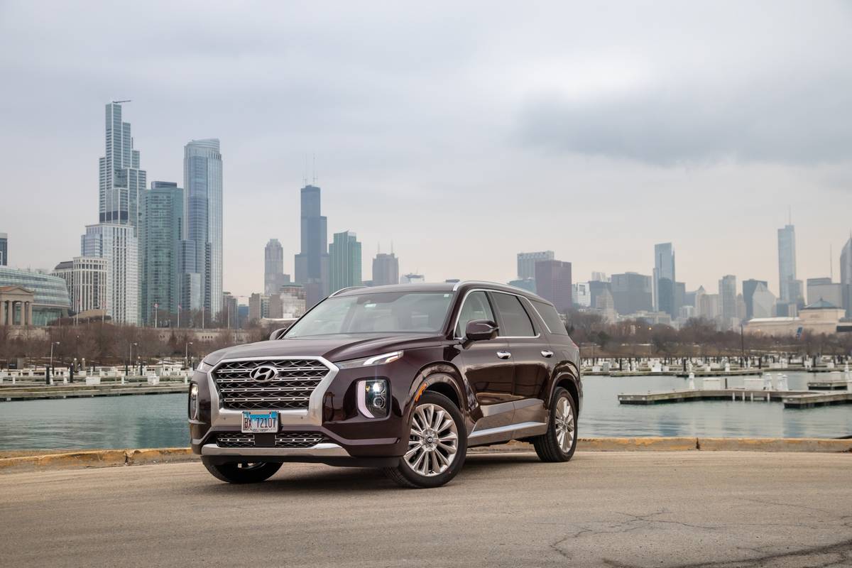 Red 2020 Hyundai Palisade parked in front of the Chicago Skyline