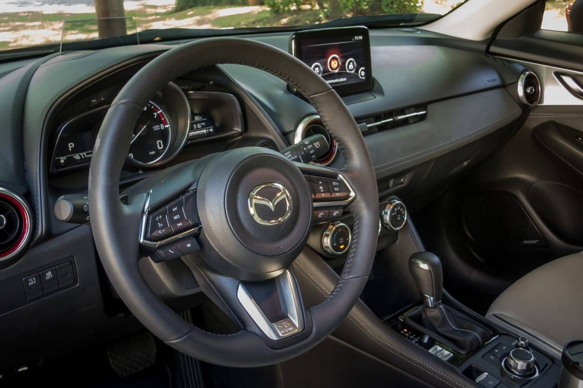 The chunky, leather-wrapped steering wheel feels good in your hands. | Cars.com photo by Fred Meier