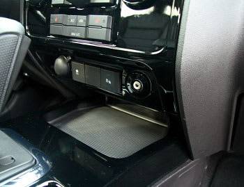 The 2008 Escape adds a standard auxiliary input so you can plug in your MP3 player &#x2014; or even a laptop if you wish &#x2014; through the stereo. What did we do without these? | Joe Wiesenfelder image