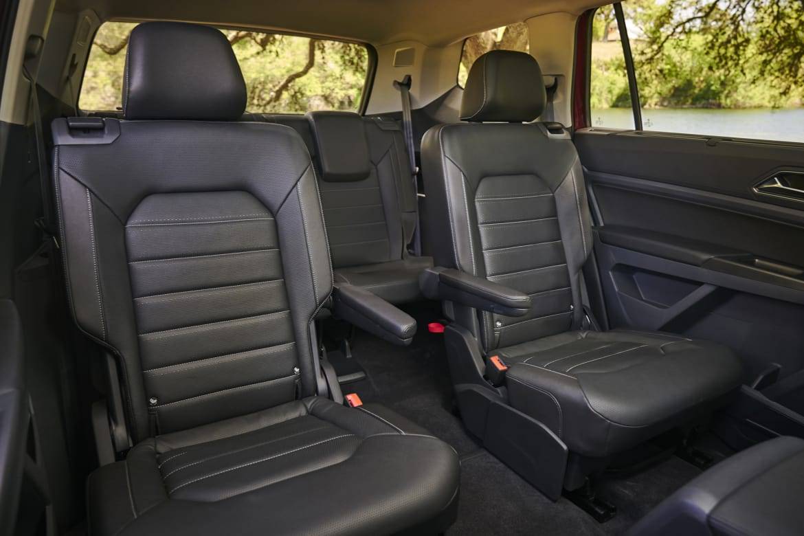 Black second-row captain's chairs in a three-row SUV