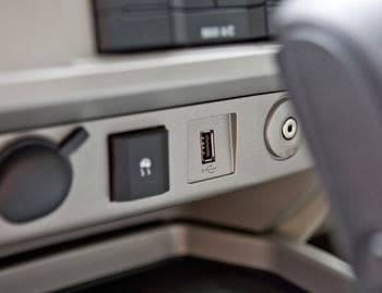 The 2009 Escape now offers a digital USB input (above) for audio devices as part of the Sync entertainment/<br/>communications system. It&#39;s optional on lower trim levels and standard on the Limited. An analog auxiliary input (below) remains standard. | Cars.com photo by Ian Merritt