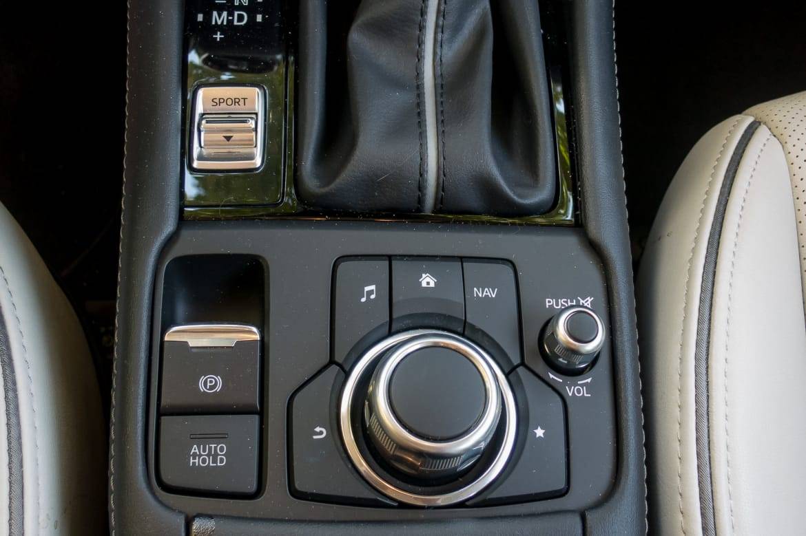 Knobs and buttons control the media system; the display is a touchscreen when the vehicle is stopped.  | Cars.com photo by Fred Meier