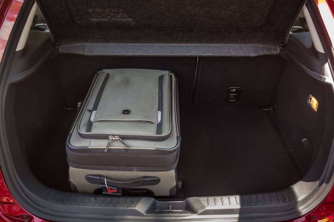A carry-on bag fits front-to-back (three vertically) in the 9.6 cubic-foot cargo hold (12.4 cubic feet in cars without Bose audio). | Cars.com photo by Fred Meier