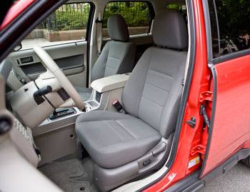 The front seats are reasonably roomy, but there&#39;s no standard driver&#39;s height adjustment; that comes with the power seats in the XLT (shown) and Limited. A telescoping adjustment for the tilt steering wheel would be a good addition. The leather up | 
