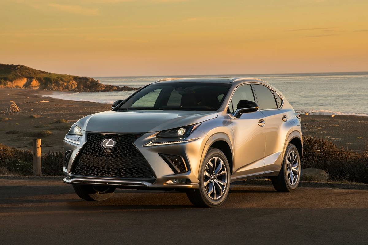 2021 Lexus NX 300 parked in front of a sunset over a beach