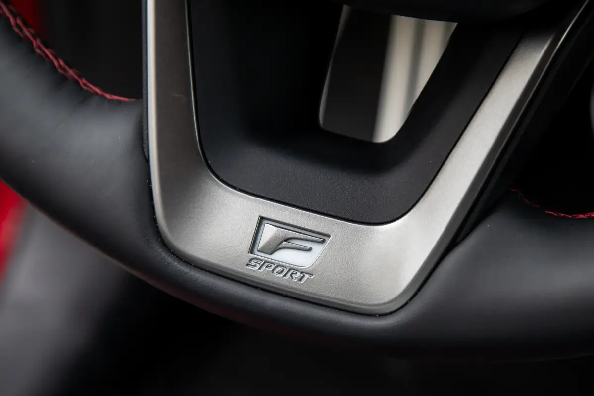 lexus nx 350h f sport 2026 23 interior steering wheel badge jpg