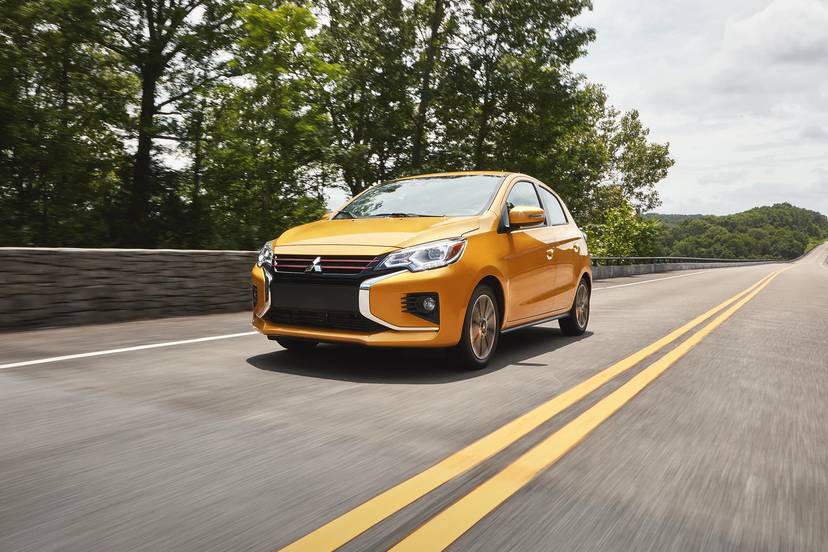 Yellow 2021 Mitsubishi Mirage driving on a road