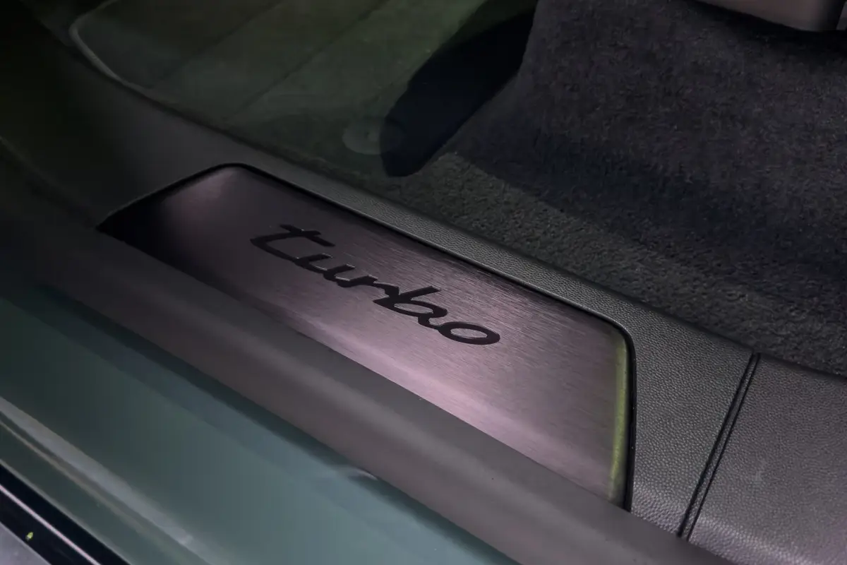 porshe cayenne electric 2026 16 interior door badge scaled jpg