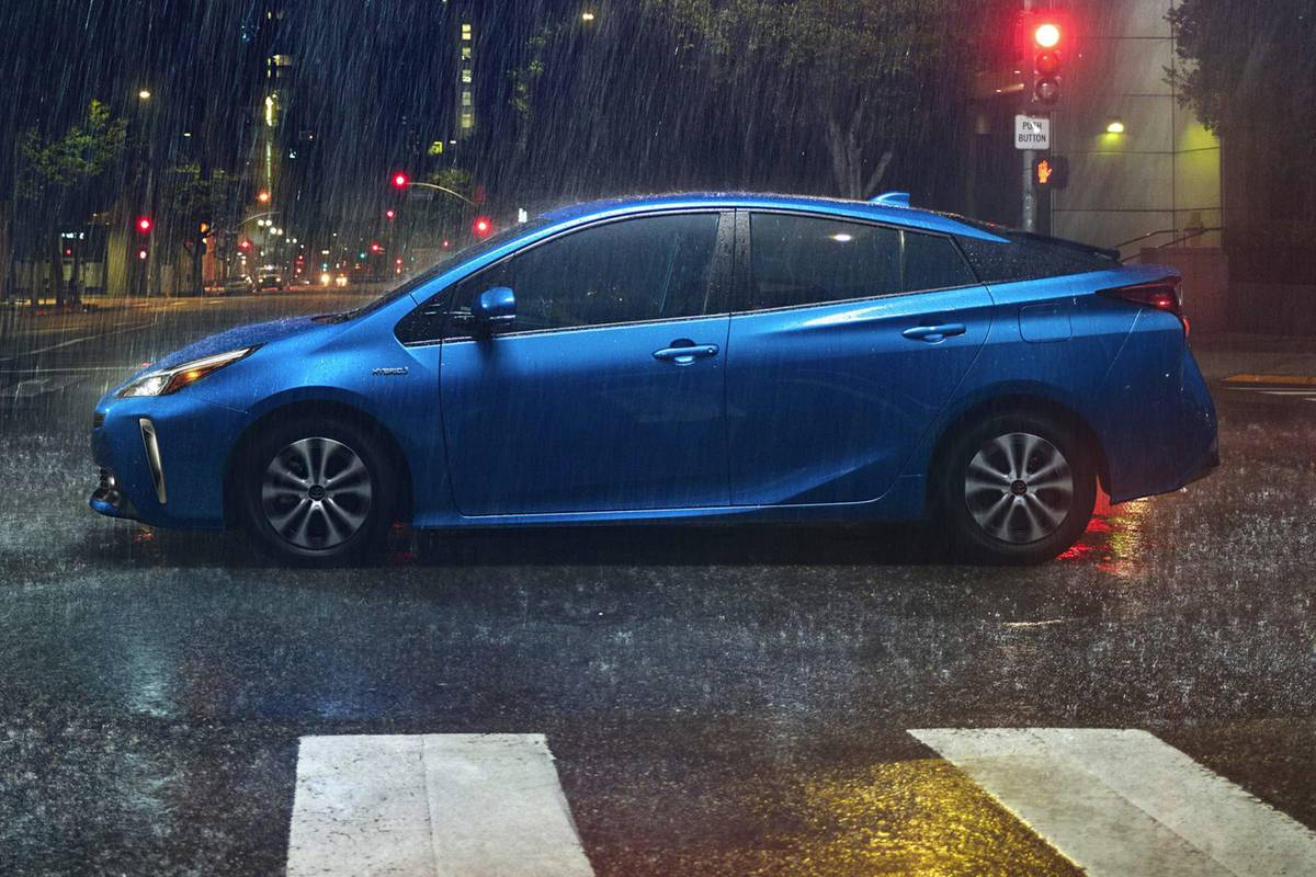 Side view of a 2020 Toyota Prius in the rain