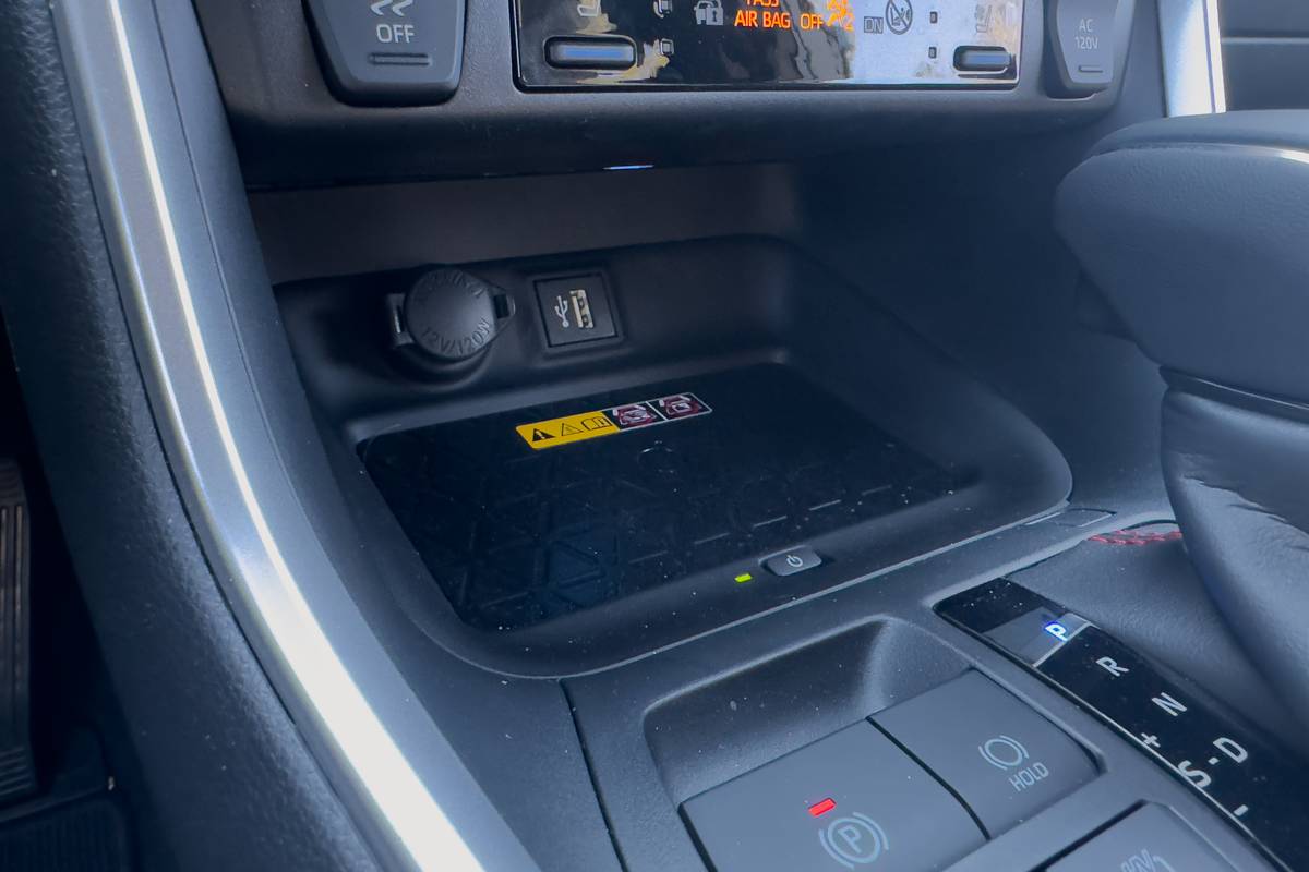 toyota rav4 plug in hybrid xse 2025 15 interior charge pad jpg