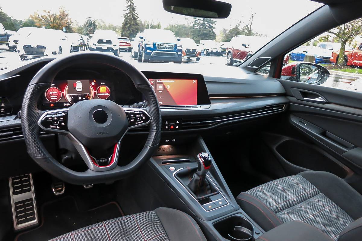 volkswagen-golf-gti-2022-05-center-stack-display-compact-dashboard-front-row-interior-steering-wheel