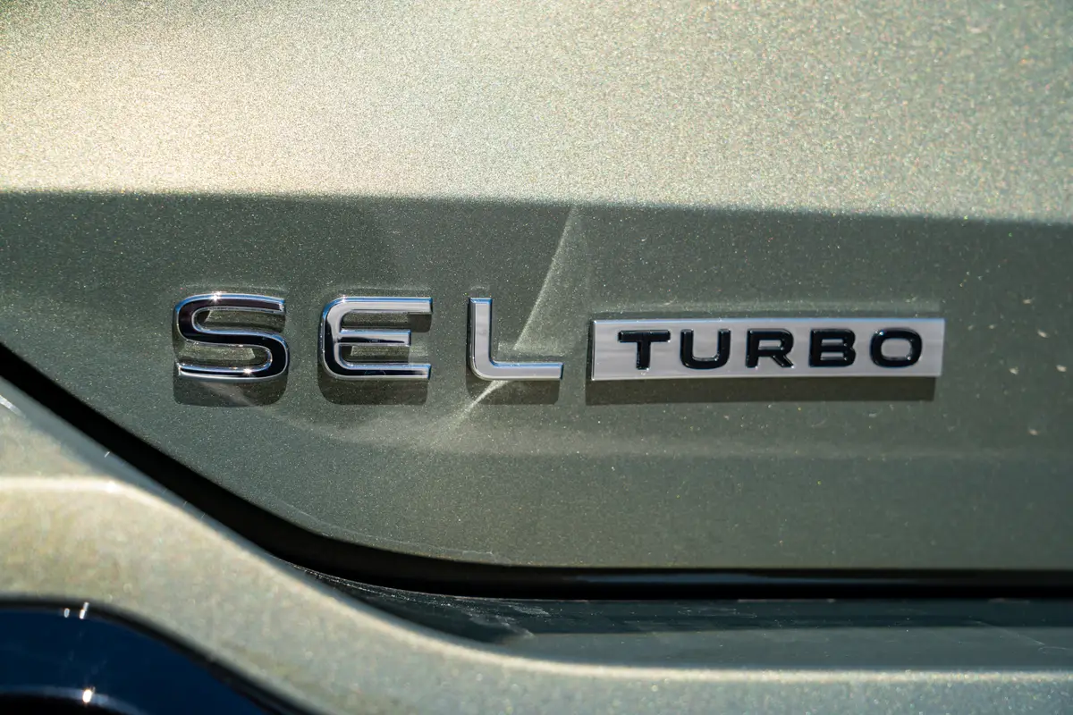 volkswagen tiguan sel r line turbo awd 2026 45 exterior badge detail jpg
